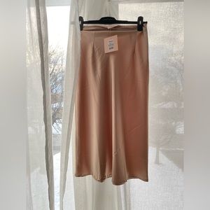 Never worn Showpo satin skirt